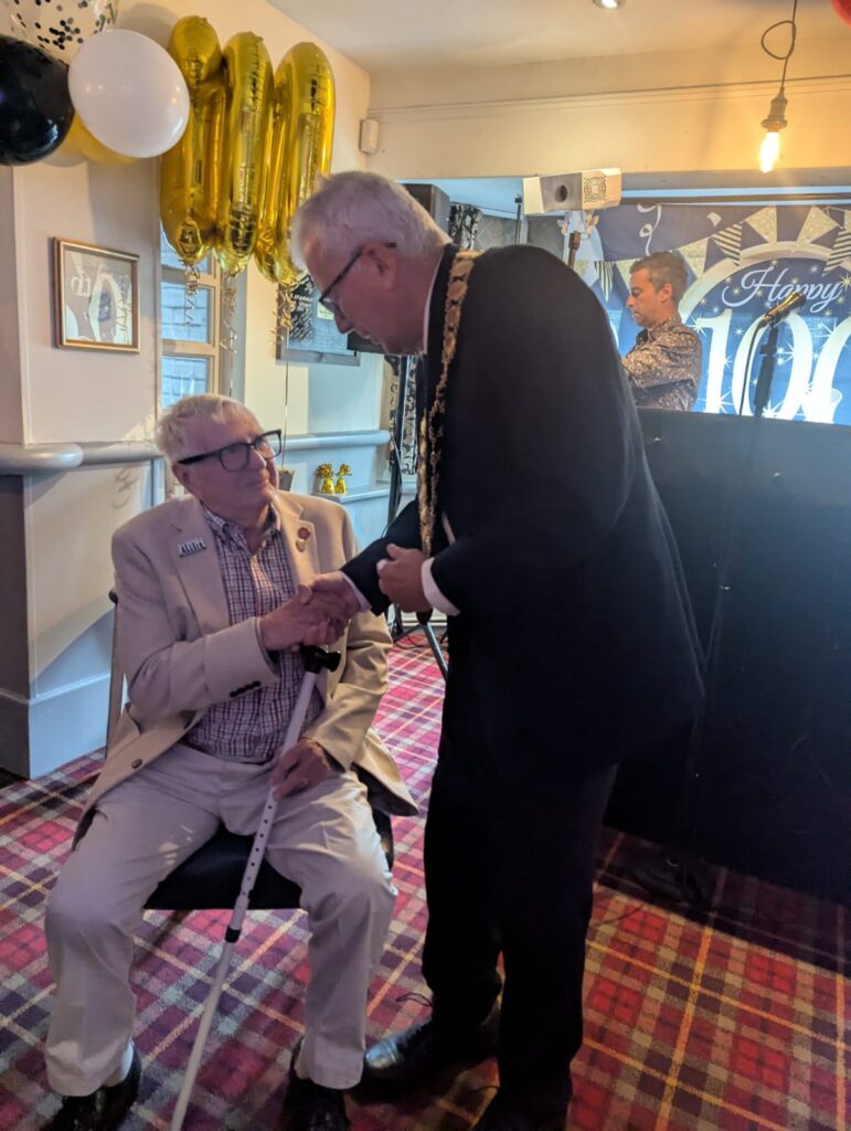 Acting Mayor Mark Griffin shaking Dennis Thatcher's hand